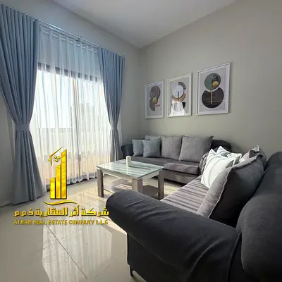 Luxurious 1-bedroom apartment with a living room and open view – Ajman, Corniche, Al Nakhil 2 – Furnished, for monthly rent.