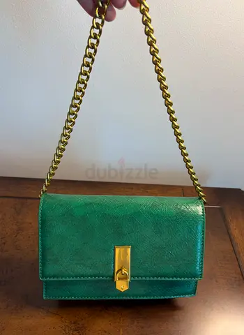 Green leather shoulder bag with gold chain strap, good condition