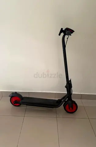 Electric Scooter with Red Wheels - battery is perfect condition. Good Working Condition. Used rarely