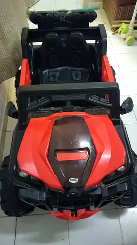 Red and Black Battery-Powered Ride-On Car for Kids — Good Condition