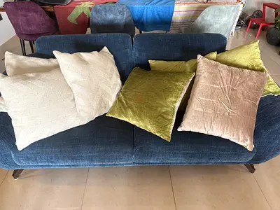 7 square cushions, good condition, AED 30 each, AED 175 the lot.