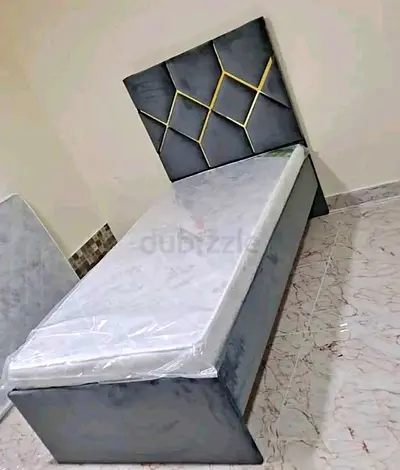 Single upholstered bed with geometric headboard - like new