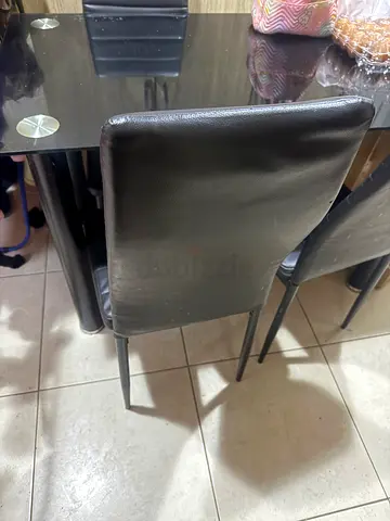 Set of 4 black faux leather dining chairs - good condition