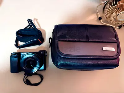Sony Mirrorless Camera with Case and Strap - Good Condition