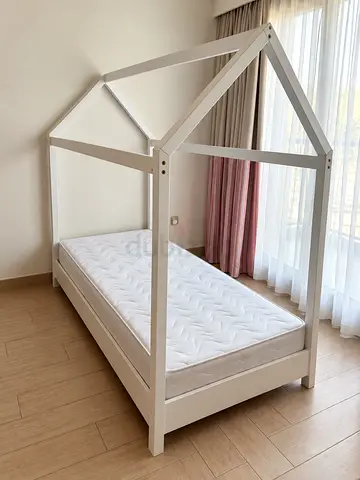 White wooden house-frame single kids bed with mattress