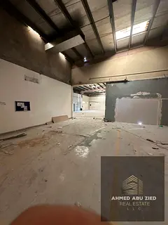 Large warehouse featuring an equipped mezzanine, two restrooms, and an administrative office. Power
