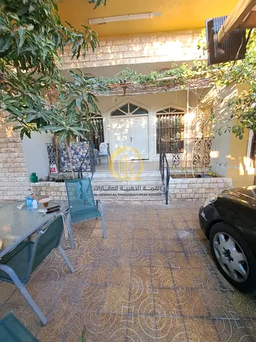 House for sale in Al Jazat, Sharjah; a corner property situated on two paved roads, with an area of ​​6,300 square feet.