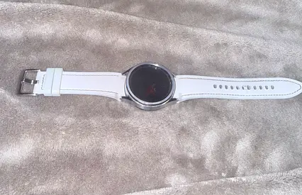 White round-screen smartwatch with leather strap - good condition