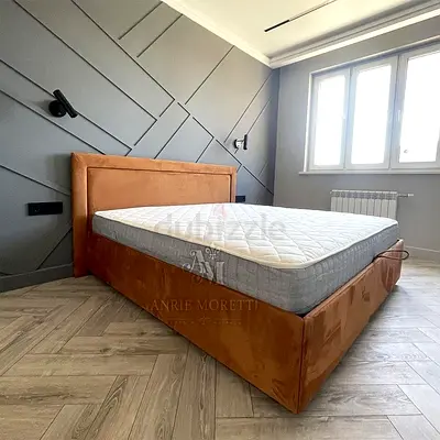 Modern upholstered king-size bed with padded headboard