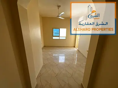 شقة غرفتين وصالة للإيجار السنوي في الراشدية 3 عجمان | بجوار أبراج عجمان 1، مساحة كبيرة، بلكونة بإطلالة مفتوحة وتكييف اسبليت