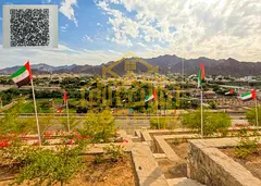 A distinctive farm for sale in Masfout (Basin 1), featuring a unique mountain view
