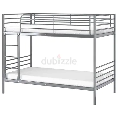 Durable grey metal bunk bed featuring two single lower beds with matres
