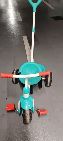 Used toddler tricycle with parent push handle
