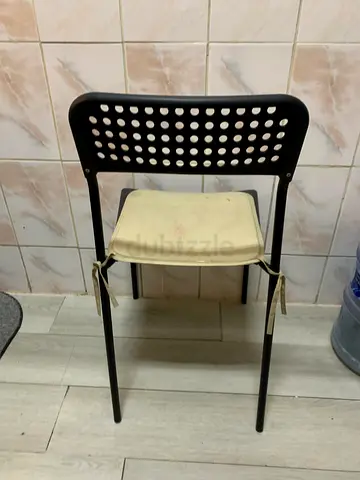 Simple black metal dining/desk chair with removable cushion