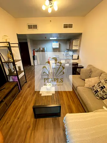 Furnished one-bedroom apartment with a living room available for annual rent in City Tower, Al Nuaimiya 3. It features a master bedroom, a balcony, an