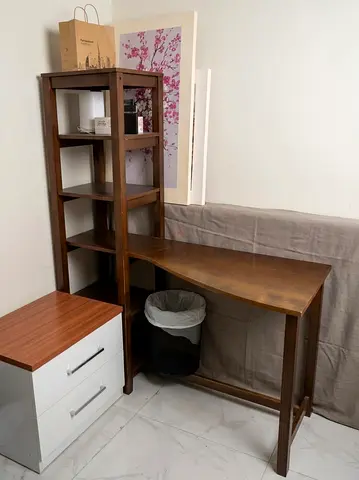 Wooden corner desk with built-in shelving - good condition