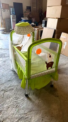 Green Baby Bassinet with Mosquito Net and Wheels