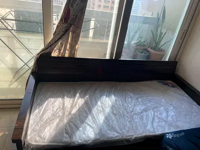 Sofa cum bed with mattress (dark wood) - with storage space below..