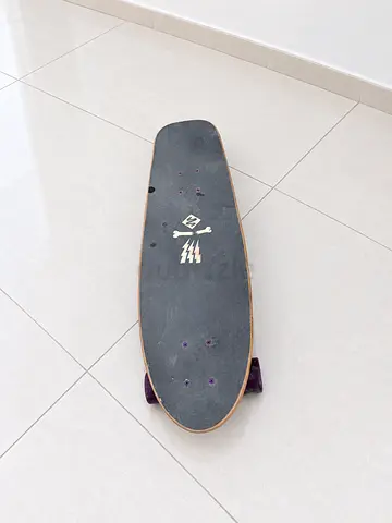 Cruiser Skateboard with Black Grip Tape and Purple Wheels