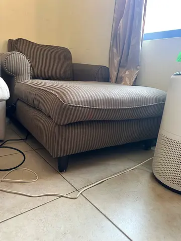 Two-seater striped fabric sofa in good condition and feather