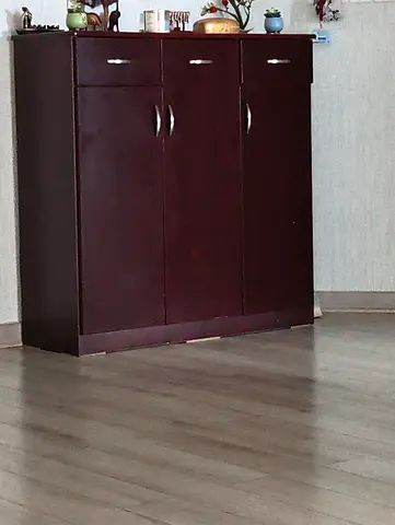 Wooden Shoe cabinet ..three doors with 3 drawers .. excellent condition