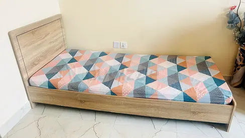Single wooden bed frame with patterned mattress - good condition