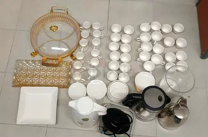 Large white porcelain tea set with trays, kettles and serving dishes - used