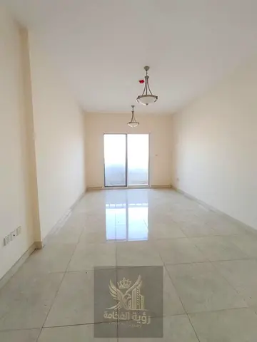 For annual rent in Al Taawun two bedrooms and living room two master bedrooms balcony open view 3 bathrooms central AC free parking prime location dir