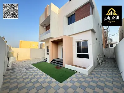 Villa for sale in the Al Yasmeen area, Ajman. Includes electricity, water, and air conditioning. Features 3 master bedrooms, a majlis, a living room,