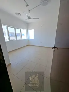 For rent in Al Qulaiya Sharjah: 1 bedroom and living room, central AC and gas, 2 bathrooms, second t
