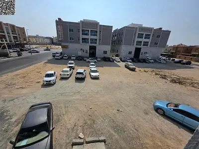 Land for sale, 17,000 sq ft, directly on Al Talah Street and Al Shurooq Mall, in a prime location in Al Rawda 2 area, Ajman.