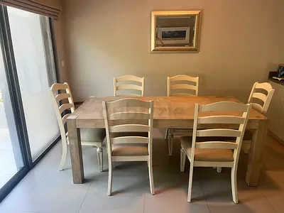 Solid wood dinning table with 6 chairs.