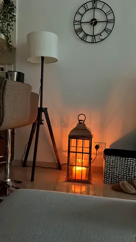 Tripod lamp and Large rose gold lantern with large candle