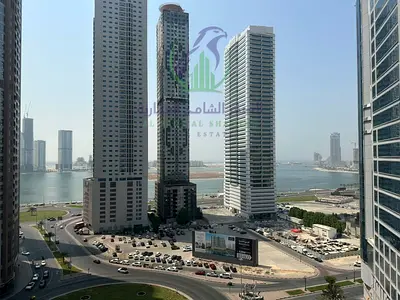 Two bedroom apartment with living room for annual rent in Al Taawun with balcony open view spacious area modern finishing and prime location