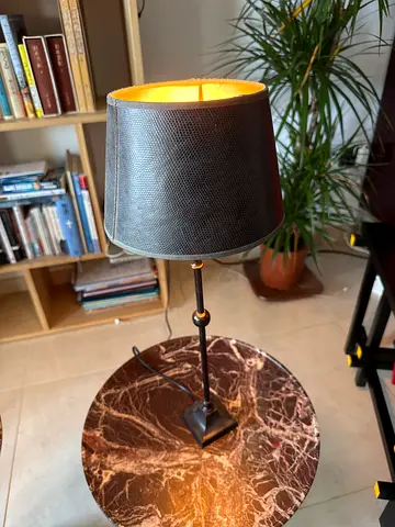 Modern table top lamp with textured brown leather shade, AED 50