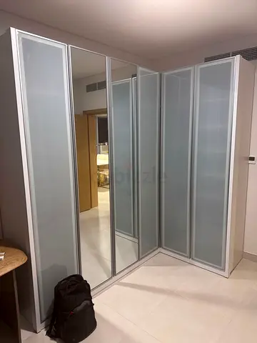 HomeCenter PAX Corner Wardrobe with Frosted Glass Doors, like new Condition. Original price:4,870AED