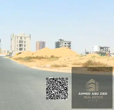 Residential and commercial lot at the corner of two streets (G+4) in Global City, Al-Aaliya, Ajman; freehold with the option to sell individual apartm