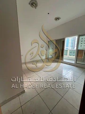 Only 52,000! Spacious 2-bedroom + hall apartment with a balcony—AC and maintenance included (landlord-provided)—in Al Majaz 1