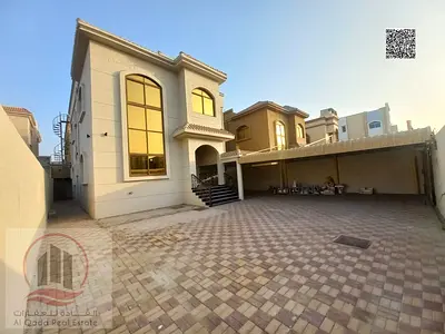 Villa for rent in Ajman, Al Muwaihat area: 5 master bedrooms, a majlis, a living room, and a maid's room.