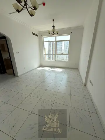 For rent: 1-bedroom apartment with a spacious living room and open view in Al Majaz 3, featuring 2 bathrooms, gym, swimming pool, and 1 month free.
