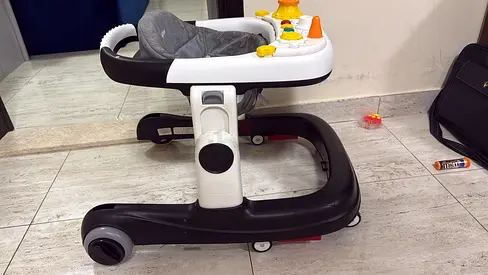 Baby walker with activity tray and adjustable height - good condition