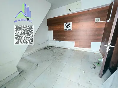 Commercial shop for rent in Al Nuaimiya 2 on Kuwait Street, offering 700 sq. ft. including ground floor and mezzanine, with a bathroom and a suitable