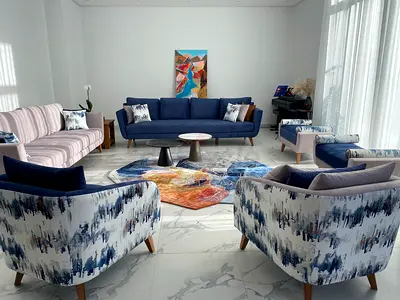 Modern Living Room Sofa Set with Patterned Accent Chairs and Divans (benches) and Throw Cushions.