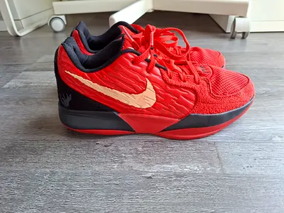 Red Nike basketball shoes size unknown, lightly used