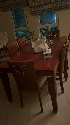 Solid wood dining table with 6 matching chairs - good condition