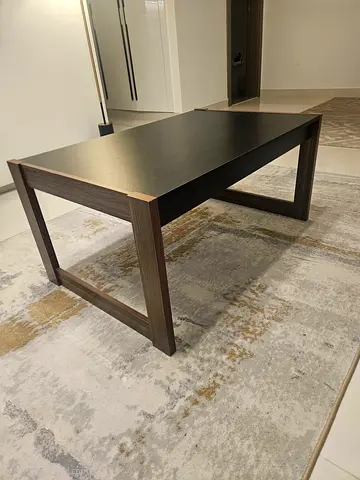 Modern dark wood rectangular coffee table - working condition. Minor repair made to one leg