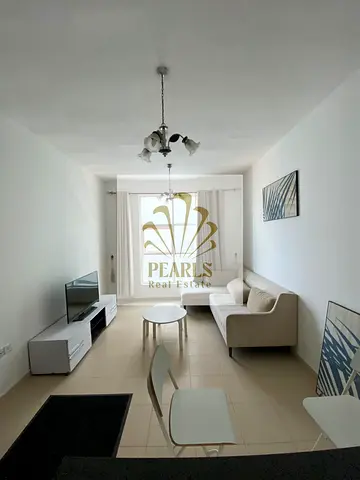 Furnished 1BR apartment for annual rent in City Tower, Al Nuaimiya 3. Master bedroom, 2 baths, balcony, free parking, AED 30K, 4 payments, cheque depo