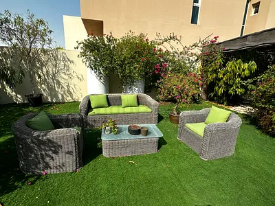Outdoor wicker 3-seater sofa with green cushions waterproof