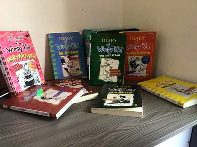 Collection of 8 Diary of a Wimpy Kid paperback books (Part pooper is original hardcover, rest copy)