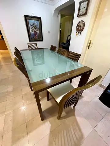 Wood and glass dining table with 8 matching chairs